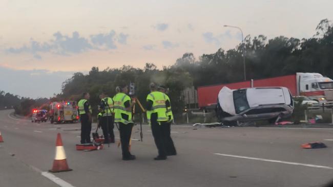 The white Jeep had overturned after it collided with another vehicle just north of the Coomera exit on the M1.