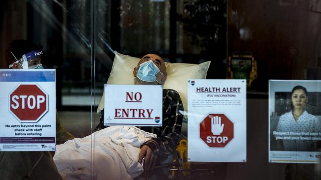 An Epping Gardens Aged Care resident waits to be removed from the home. Picture: Getty Images