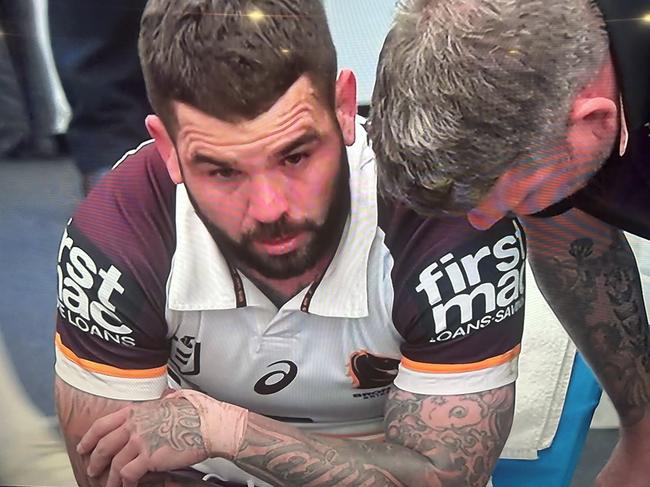 Broncos skipper Adam Reynolds in tears at halftime of the match against the Storm after succumbing to a knee injury.