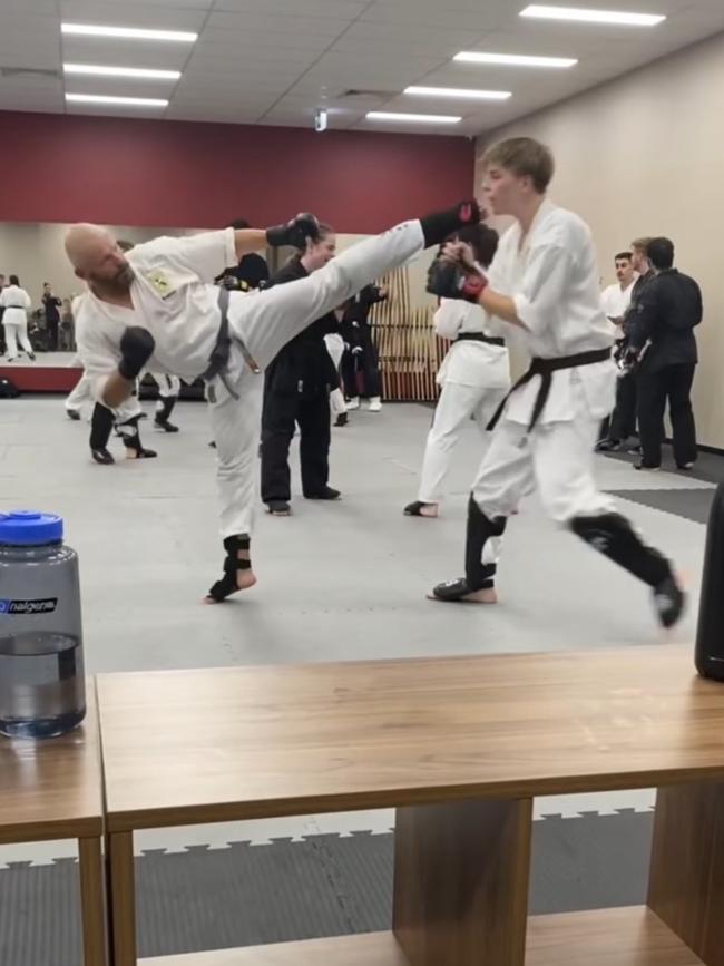 Nathan Cheong sparring in taekwondo.