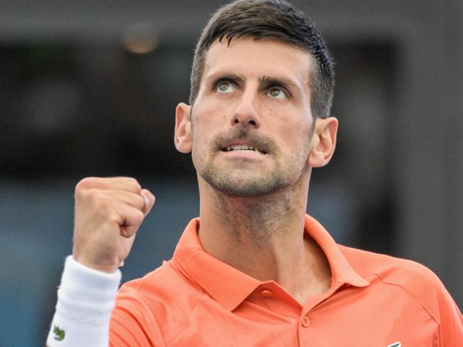 Serbia's Novak Djokovic celebrates his victory against France's Quentin Halys during their men's singles match at the Adelaide International tennis tournament in Adelaide on January 5, 2023. (Photo by Brenton EDWARDS / AFP) / - IMAGE RESTRICTED TO EDITORIAL USE - STRICTLY NO COMMERCIAL USE-