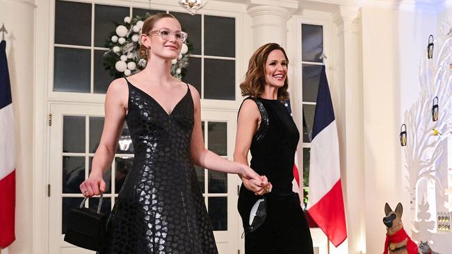 Proof they are two different people! Violet (left) and mum Jennifer at a White House dinner last year. Picture: AFP