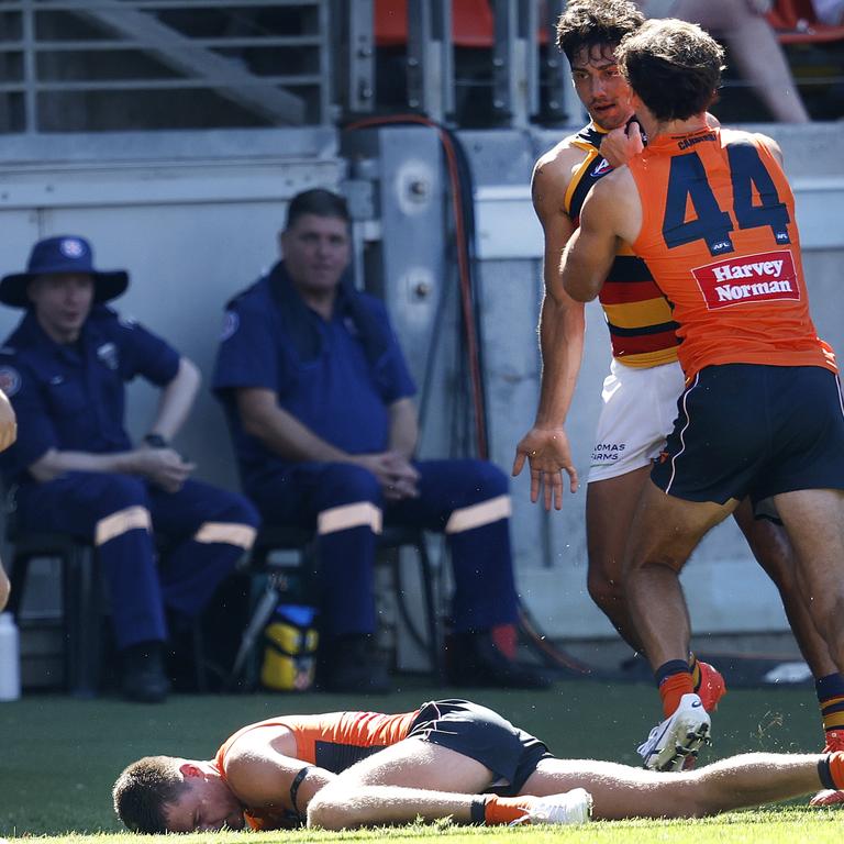 GWS wingman Jacob Wehr was floored by a heavy and high hit from Crows forward Shane McAdam. Picture: Phil Hillyard