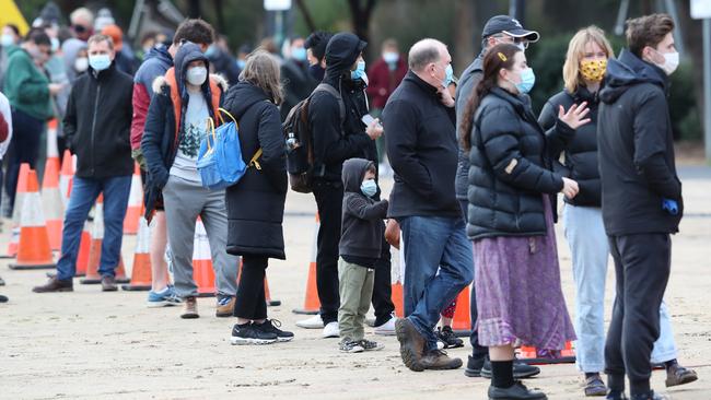 Local residents line up for Covid testing near an apartment block in Southbank. Picture: NCA NewsWire