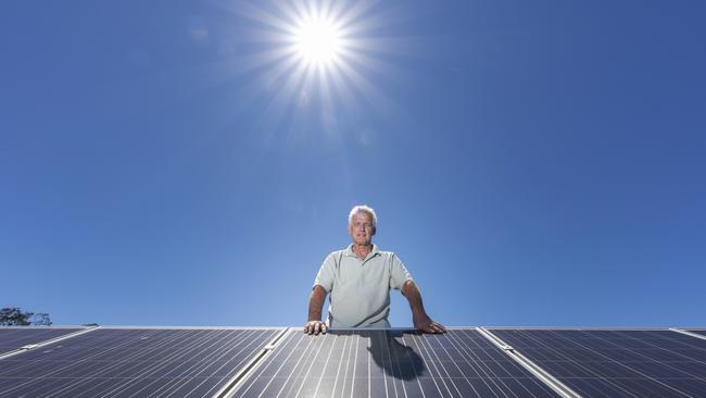 Julian Biega with existing solar panels helping power the milking shed at his dairy. Picture: Supplied