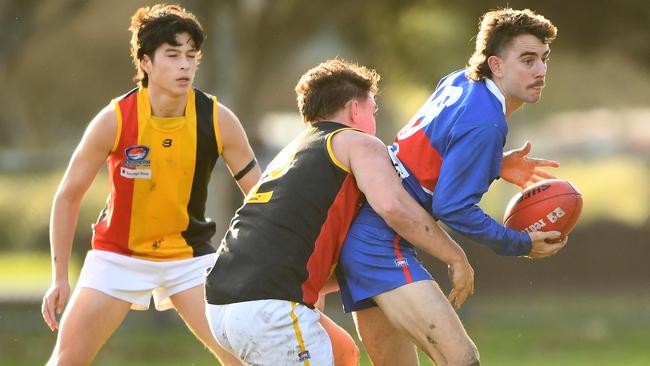 SFNL: St Paul’s James Sziller looks for an option under pressure. Picture Josh Chadwick