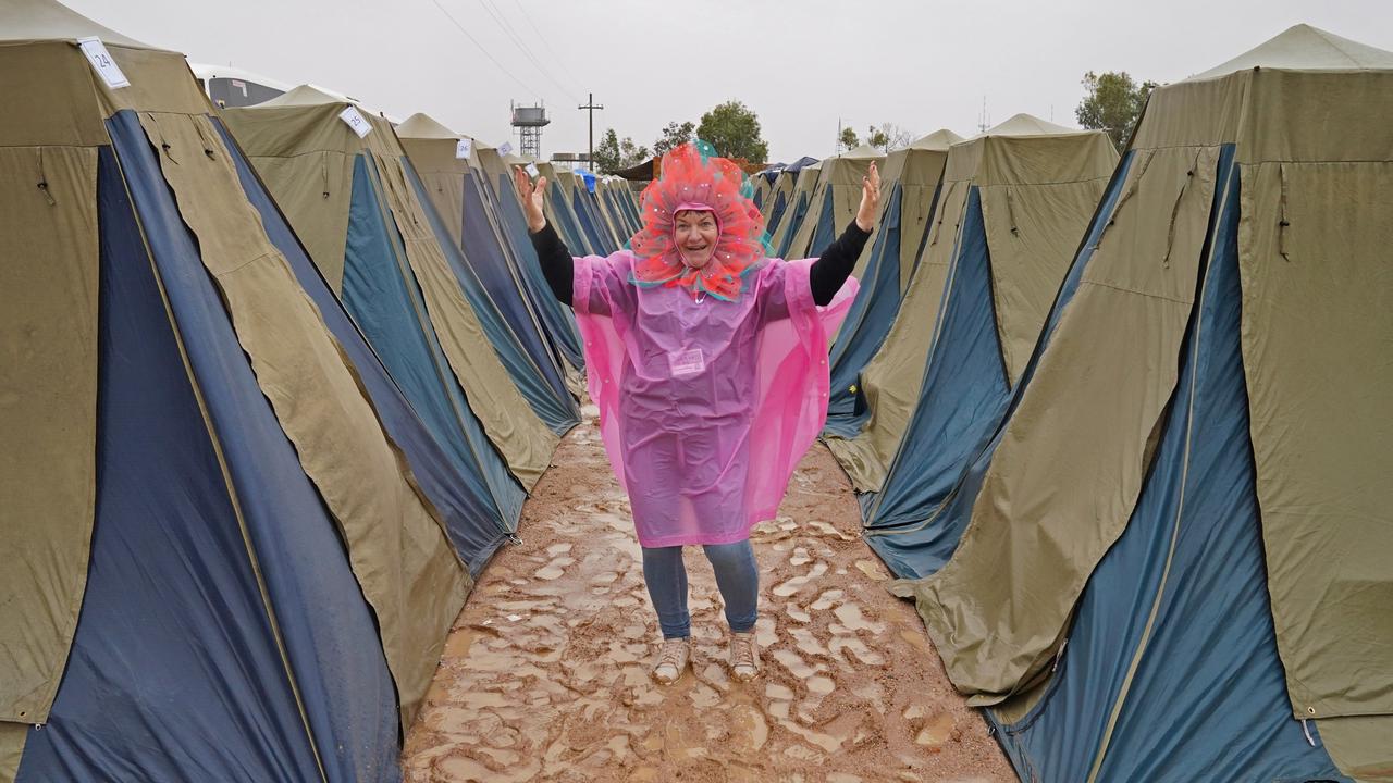 Forget shoes, some revellers chose to go barefoot in the mud. Picture: Brian Roberts/MaxAgency