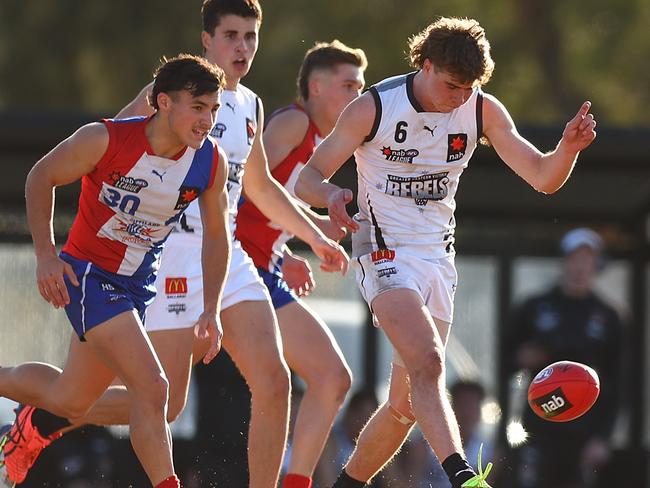 MELBOURNE, AUSTRALIA - AUGUST 07: Tristan Maple of the GWV Rebels kicks ahead during the NAB League Boys match between Gippsland and Greater Western Victoria at Shepley Oval on August 07, 2022 in Melbourne, Australia. (Photo by Graham Denholm/AFL Photos via Getty Images)