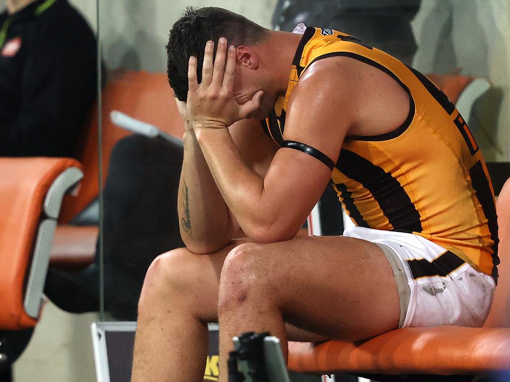 Hawthorn's Jonathon Patton in tears on the bench injured during the AFL match between Collingwood and Hawthorn at Giants Stadium.