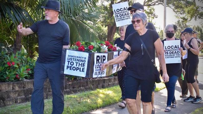 Protesters against the Cultural and Civic Space carrying a coffin proclaiming ‘democracy is dead’ prior to the March 4 extraordinary meeting.