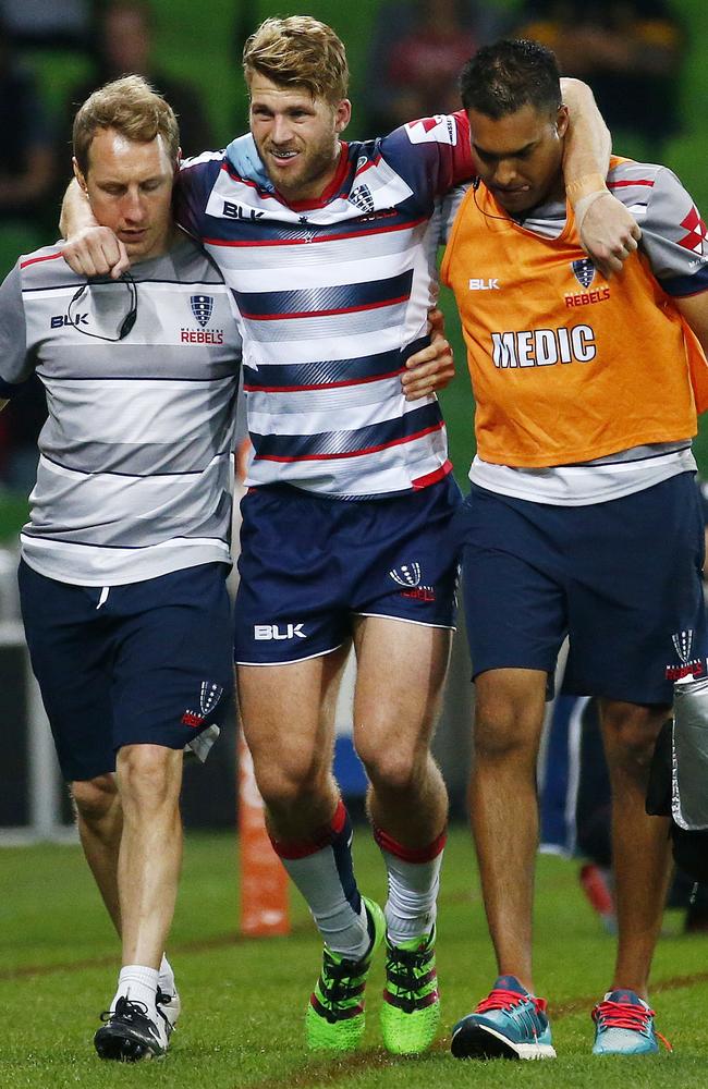 Dom Shipperley leaves the field injured at AAMI Park.