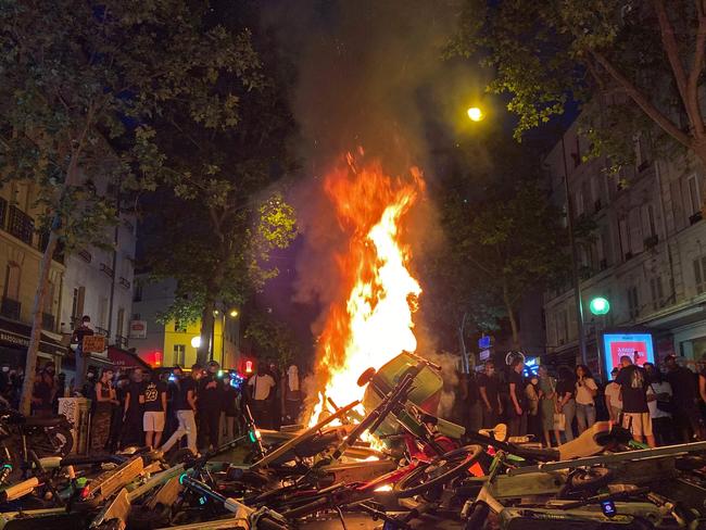 Protesters burn trash bins, shared scooters and bicycles in Paris. Picture: Mohammad Ghannam