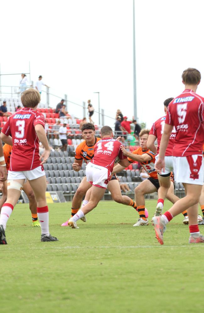 Kobi Floro (left) and Max Blanch (right) making a tackle on Charlie Dickson.