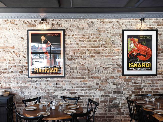 Big family-size tables and vintage Italian posters at the new il Buco Kitchen. Picture: Flavio Brancaleone