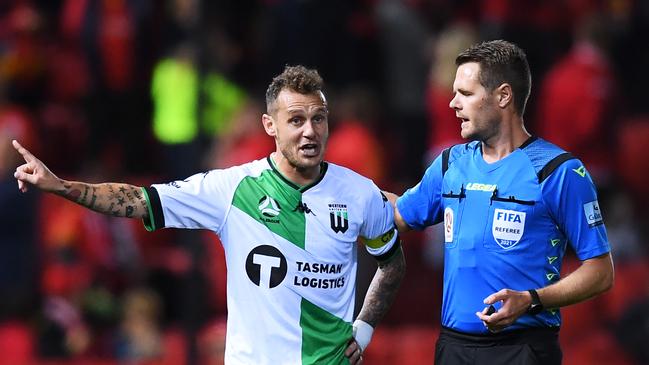 Referee Chris Beath (right) speaks to Western United captain Alessandro Diamanti during an A-League match last season. Picture: Mark Brake/Getty Images