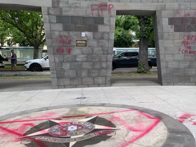 December 13 2024: Victoria Police memorial in Melbourne's Kings Domain gardens has been targeted by graffiti on December 12, with offensive slurs including "the only good cop is a dead cop" plastered in red across the site. Picture: ABC News, Tania Lee