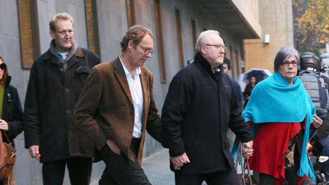 Doctor Stephen Edwards (second from left with white shirt and brown jacket) leaving the Supreme Court in Hobart after being given bail. Doctor Edwards is accused of killing his mother Nelda Mavis Edwards 88 at Sandy Bay. Picture: NIKKI DAVIS-JONES