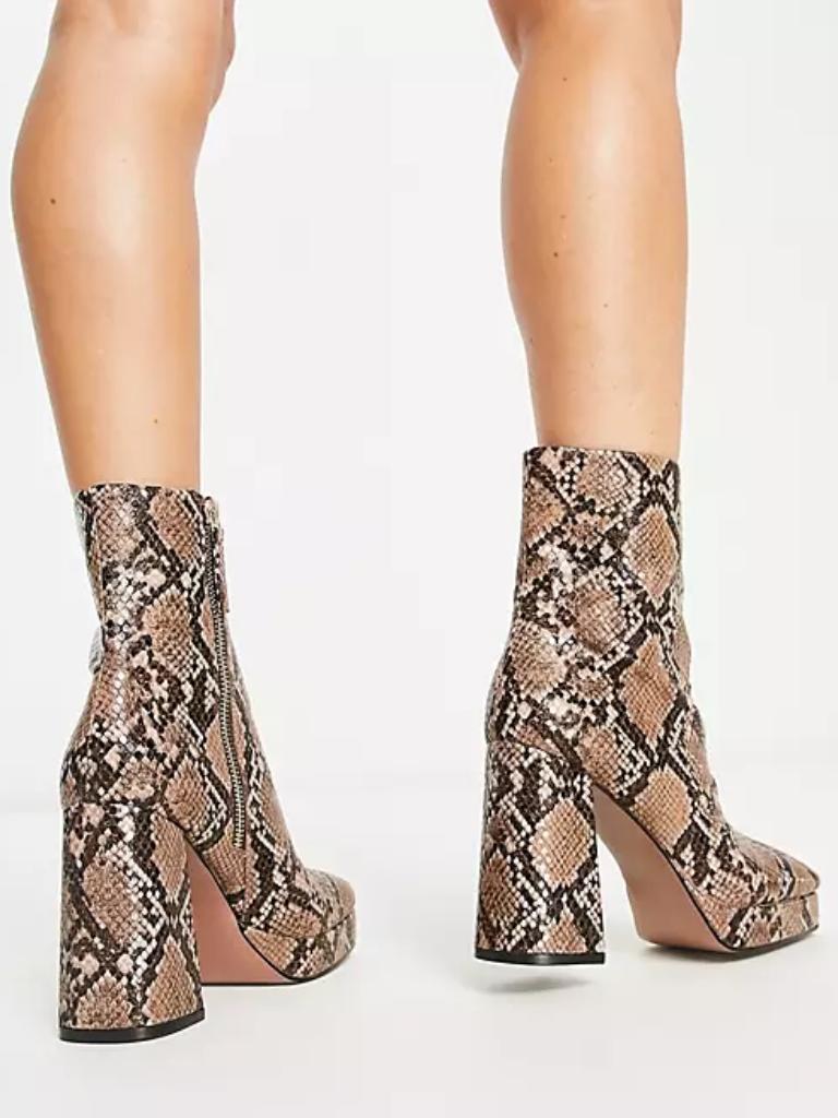 ASOS DESIGN Eden high-heeled platform boots in snake. Picture: ASOS.