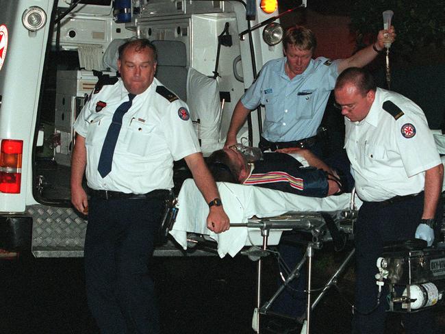 Semple being wheeled into the ambulance.