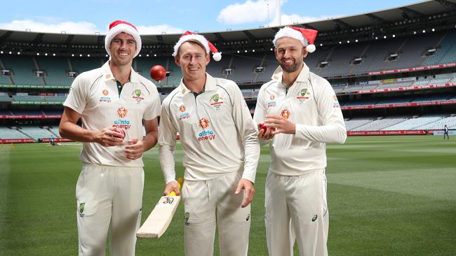 Pat Cummins, Marnus Labuschagne and Nathan Lyon prepare to celebrate Christmas at the MCG in Melbourne. Picture: Alex Coppel.