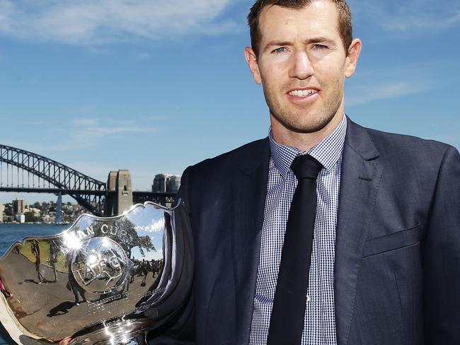 SYDNEY, AUSTRALIA - DECEMBER 02: Former Socceroos Brett Emerton poses with the Asian Cup trophy during the Asian Cup Trophy Tour at Sydney Harbour on December 2, 2014 in Sydney, Australia. (Photo by Matt King/Getty Images)