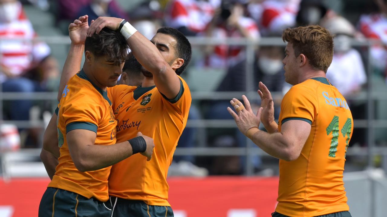 The Wallabies celebrate after Jordan Petaia crossed for their second try against Japan. Photo: Getty Images