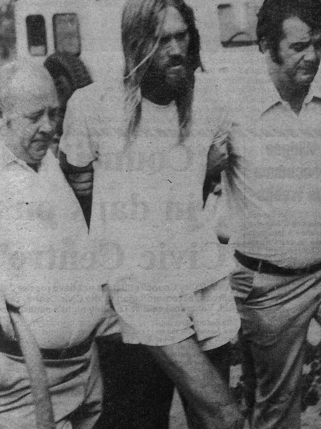 Gympie detectives Don Robertson and Neil Magnussen arrive at the Gympie Court House with Peter Lamb (middle).