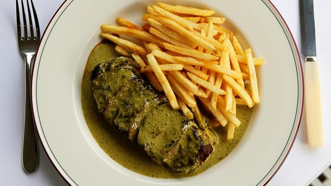 Entrecote’s grilled steak with herb sauce and frites. Picture: Tim Carrafa