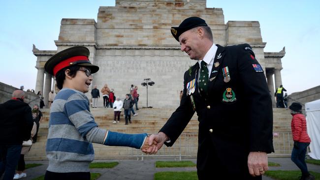 Trooper Dave Owen (RNZAC) meets aspiring serviceman James Madner at the Dawn Service Picture: Andrew Henshaw