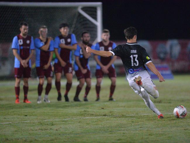 Coomera players (left) do battle against Mackay and Whitsunday Magpies Crusaders in the FFA Cup’s Round of 32 last season.