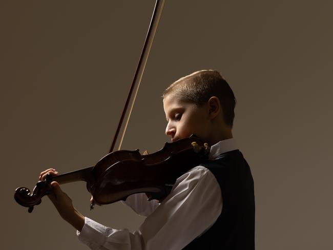 Qweekend BCM. Child Prodigy.Allesandro Martinese of Queensland Youth Orchestras in concert gear with violin.Photograph David Kelly