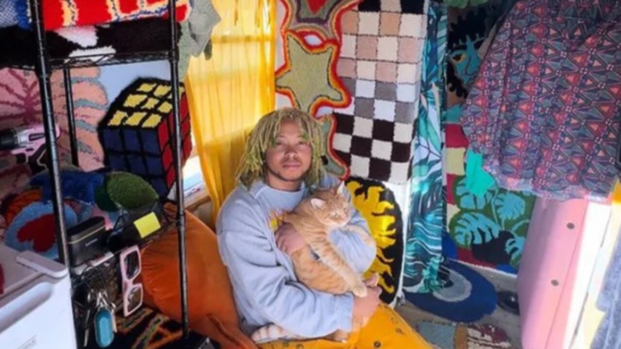 Elijah sitting in his food cart home. (Picture: Elijah Ray)