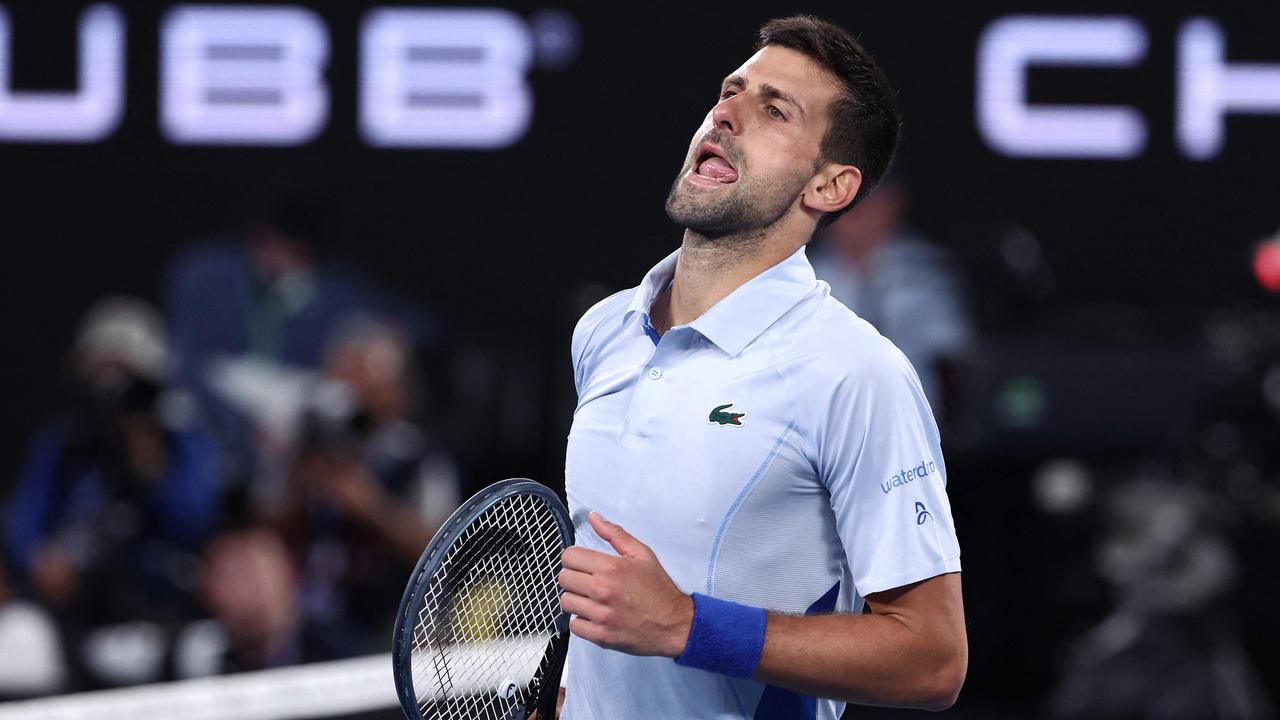 Serbia's Novak Djokovic reacts on a point against France's Adrian Mannarino during their men's singles match on day eight of the Australian Open tennis tournament in Melbourne on January 21, 2024. (Photo by David GRAY / AFP) / -- IMAGE RESTRICTED TO EDITORIAL USE - STRICTLY NO COMMERCIAL USE --