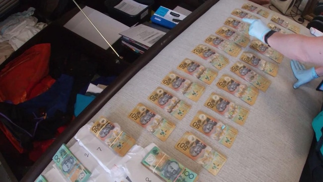 Police allegedly found wads of cash, concealed in envelopes. Picture: Queensland Police