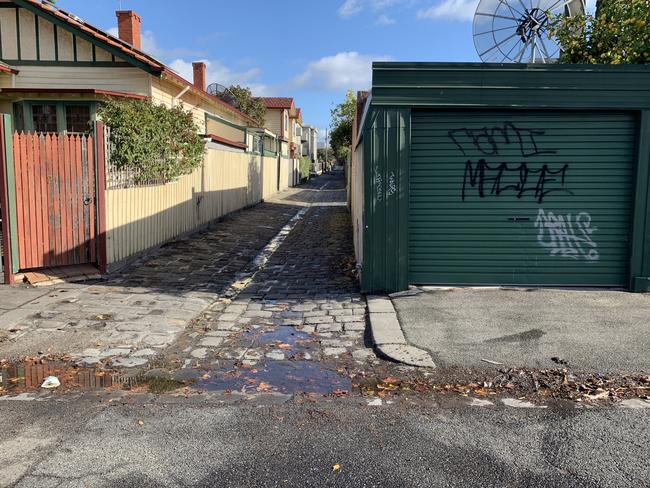 The victim was forced against this garage door before the boy fled down the alleyway. Picture: Josh Barnes