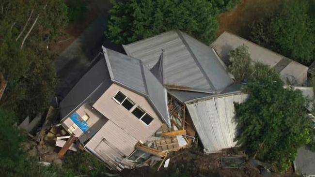 A person has been injured after a house toppled over during an apparent landslide in regional Victoria. Emergency services were called to a property on View Point Rd in McCrae on the Mornington Peninsula - about 59km south of Melbourne - about 8.45am Tuesday after a landslide caused the building to topple over. Picture: ABC