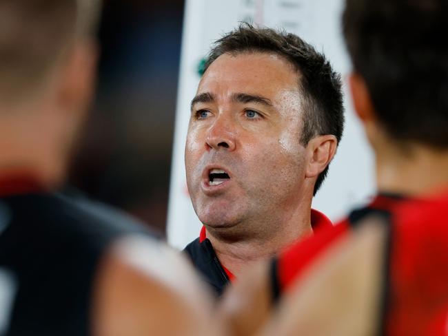 MELBOURNE - APRIL 09: Brad Scott, Senior Coach of the Bombers addresses his players during the 2023 AFL Round 04 match between the Essendon Bombers and the GWS Giants at Marvel Stadium on April 9, 2023 in Melbourne, Australia. (Photo by Dylan Burns/AFL Photos via Getty Images)
