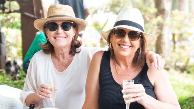 Revellers enjoy the sun and wine.