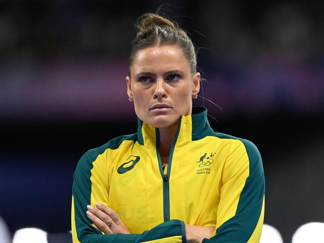 Australian pole vaulter Nina Kennedy looks on as technicians replace a non-functional crossbar raiser which got stuck during the Women's Pole Vault Final at the Stade de France in Saint-Denis, as part of the 2024 Paris Summer Olympic Games in, France, Wednesday, August 7, 2024. (AAP Image/Dean Lewins) NO ARCHIVING