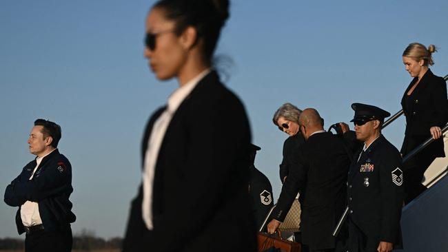 Musk, Wiles and Leavitt alight Air Force One to join the US President at the Trump National Golf Club in New Jersey for the weekend. Picture: Brendan Smialowski / AFP