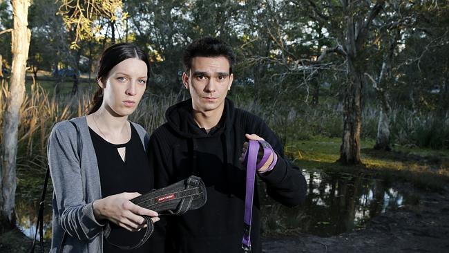 Georgina Holliday with her partner Vaughn Page at Musgrave Dog Park. Georgina believes her younger dog, one-year-old Kiko who died on Wednesday was poisoned at the park. Picture: Jerad Williams.