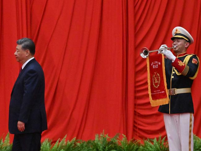 China's President Xi Jinping walks to the podium during a reception on the eve of National Day at the Great Hall of the People in Beijing on September 30, 2024. (Photo by ADEK BERRY / AFP)