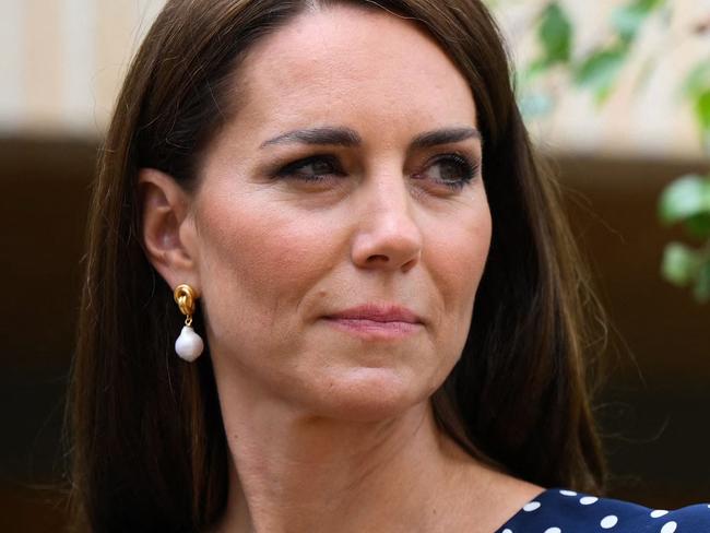 Britain's Catherine, Princess of Wales reacts during a visit of "Hope Street", a residential community piloting a new approach to supporting women in the Justice System, in Southampton, southern England on June 27, 2023. Designed and developed by the charity One Small Thing, Hope Street is the first of its kind in the UK and is designed to transform women and children's experience of the justice system. Inspired by One Small Thing's commitment to systemic change for women and children in the justice system, Hope Street offers a community alternative for women who would otherwise be imprisoned unnecessarily due to a lack of safe accommodation or concerns around their wellbeing. (Photo by Daniel LEAL / POOL / AFP)