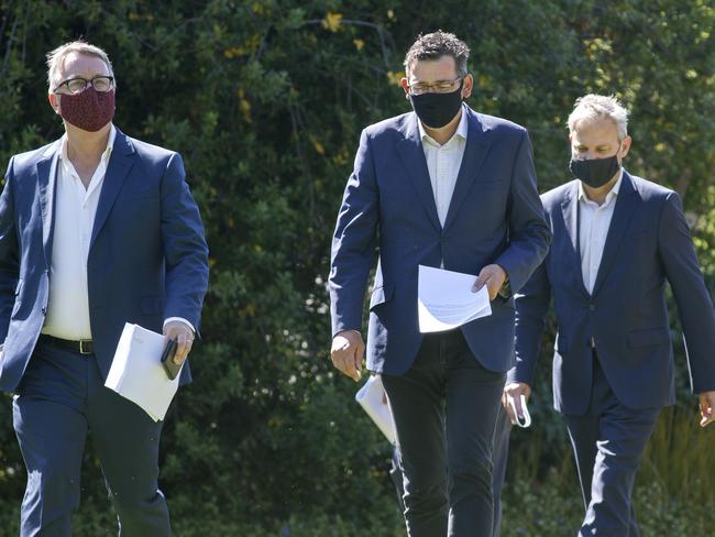 MELBOURNE, AUSTRALIA - NewsWire Photos FEBRUARY 10, 2021: Victorian Health Minister Martin Foley, Victorian Premier Daniel Andrews and VictoriaÃs Chief Health Officer Brett Sutton arrive at a press conference on Wednesday morning. Picture: NCA NewsWire / David Geraghty