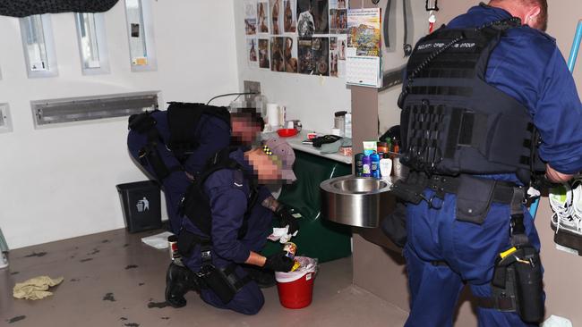 Officers from Security Operations Group (SOG) undertake a targeted covert contraband raid at Shortland Correctional Centre, Cessnock, on December 11 2021. Picture: Peter Lorimer