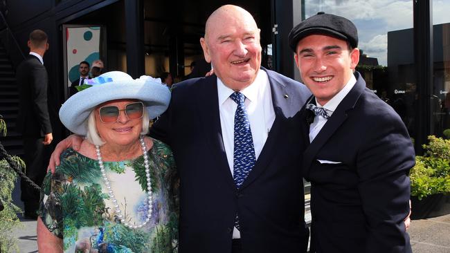 Lindsay Fox with his wife Paula and their grandchild in the Birdcage during the Melbourne Cup at Flemington racecourse. Picture: Aaron Francis