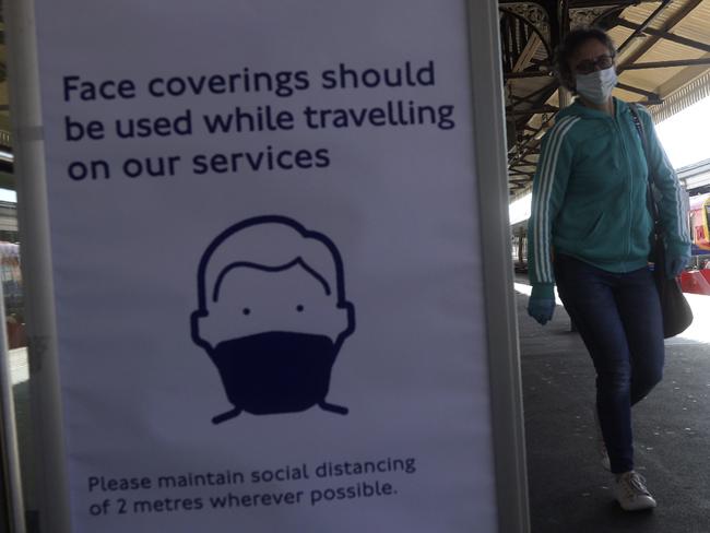 A sign advising passengers to wear a face mask at Clapham Junction station as train services increased as part of the easing of coronavirus lockdown restrictions, in London. Picture: AP