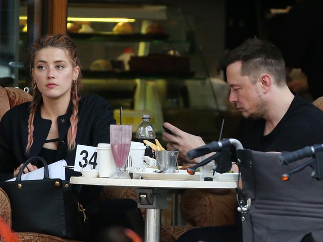 Amber Heard and Elon Musk at the Shingle Inn in Broadbeach. Picture: Nigel Hallett