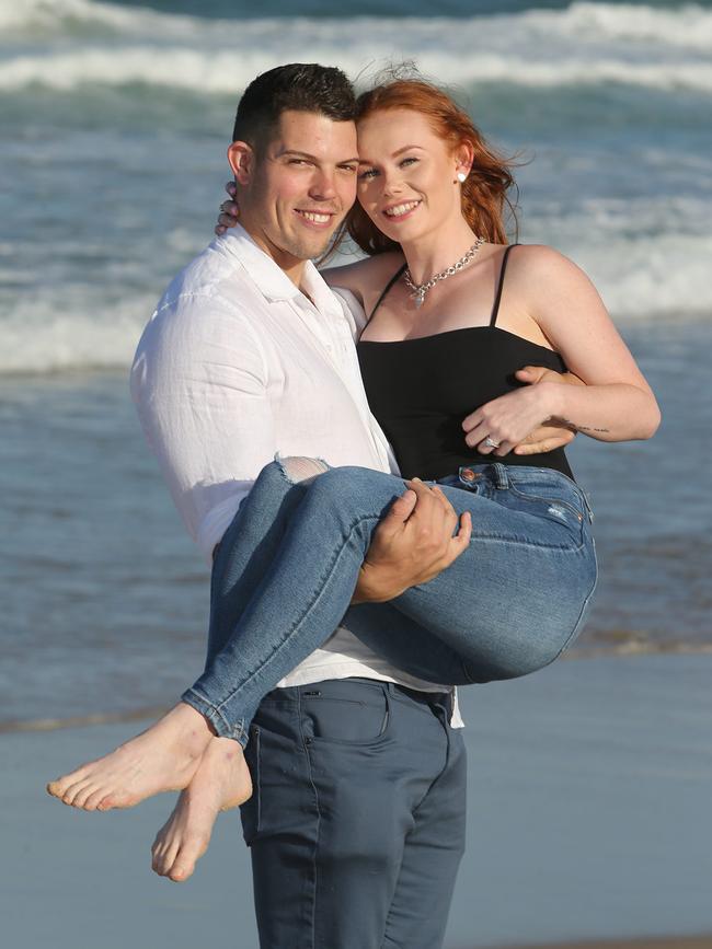 Jye Ford popped the question to the Titans’ Cheerleader of the Year Madison Catley on Saturday. Picture: Mike Batterham