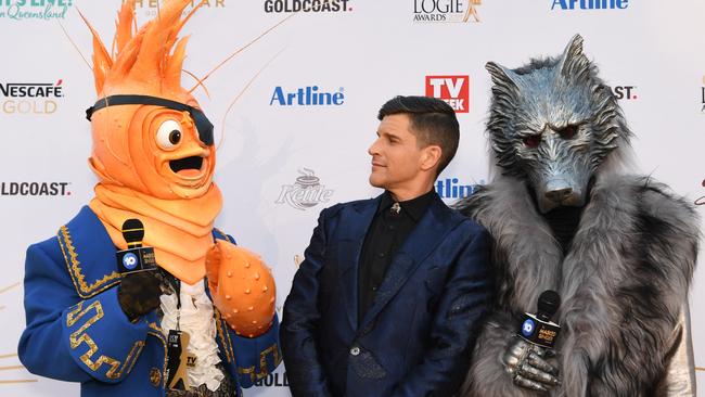 Osher Gunsberg and characters from the 'The Masked Singer' arrive at the 2019 Logie Awards at The Star Casino on the Gold Coast, Sunday, June 30, 2019. AAP Image/Dan Peled.